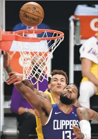  ?? Robert Gauthier Los Angeles Times ?? PAUL GEORGE is fouled by the Lakers’ Kyle Kuzma during the second half of the Clippers’ 116109 season- opening win Tuesday night at Staples Center. George led all scorers with 33 points.