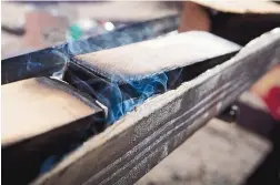  ??  ?? Toasting and charring the interior of each barrel is a key production step at the newly establishe­d D.R. Cooperage and Grain on Isleta Pueblo.