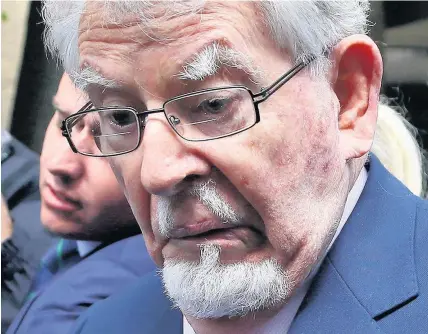  ?? Gareth Fuller ?? > Rolf Harris leaves Southwark Crown Court after prosecutor­s said that they will not seek a second retrial after the jury was discharged when it failed to reach verdicts on four indecent assault charges