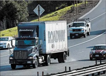  ?? JUSTIN SULLIVAN/GETTY ?? According to a report by the American Trucking Associatio­ns, the trucking industry is facing a shortage of drivers.