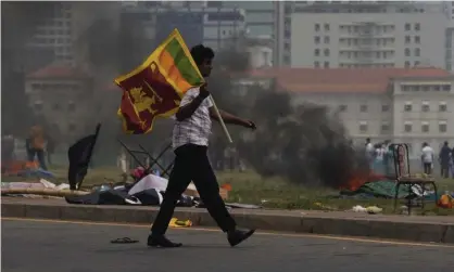  ?? Photograph: Eranga Jayawarden­a/AP ?? Weeks of unrest in Sri Lanka forced the resignatio­n of the prime minister, Mahinda Rajapaksa, as the country reels from the pandemic, costly debt and rising food and fuel prices.