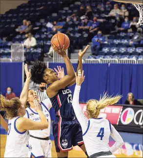  ?? John Peterson / Associated Press ?? UConn’s Christyn Williams (13) makes a layup against Creighton’s Temi Carda (4) in the first quarter on Thursday in Omaha, Neb.