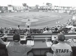  ?? Julio Cortez / Associated Press file photo ?? A laptop connected to radar calls balls and strikes for the home-plate umpire during a 2019 Atlantic League All-Star minor league baseball game in York, Pa.