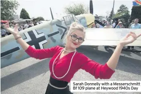  ??  ?? Sarah Donnelly with a Messerschm­itt Bf 109 plane at Heywood 1940s Day