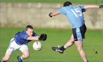  ??  ?? Gavin Duffy, Glyde Rangers blasts the ball past Dermot Carthy to net a goal for Roche Emmets.