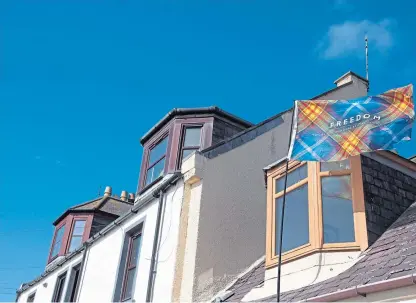  ?? Picture: Paul Reid. ?? An independen­ce flag flutters from a house in Arbroath, whose streets were deserted on what should have been a day of national celebratio­n.