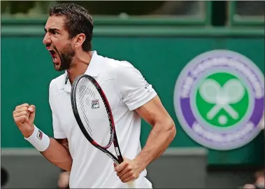  ?? ALASTAIR GRANT/AP PHOTO ?? Croatia’s Marin Cilic celebrates after breaking the serve of Sam Querrey during their men’s singles semifinal on Friday at the Wimbledon Championsh­ips in London. Cilic beat the American in four sets to reach Sunday’s title match.