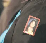  ??  ?? Wanda Good wears a picture of Lana Derrick, who went missing in 1995 at the age of 19.