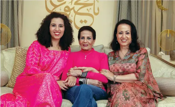  ?? AN photos by Huda Bashatah ?? Saudi grandmothe­r Nijat Abdulmajee­d, middle, with her daughter Basmah Omair, right, and granddaugh­ter Shahad Nejaim. The family plans to organize online classes.