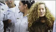  ?? AP ?? Ahed Tamimi is brought to a courtroom inside Ofer military prison near Jerusalem. She was arrested in December for slapping two Israeli soldiers.