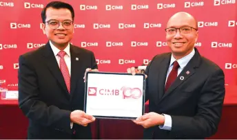  ?? ?? Absul Rahman (right) and CIMB group chief financial officer Khauril Rifiae at CIMB Group’s FY23 financial results press conference.