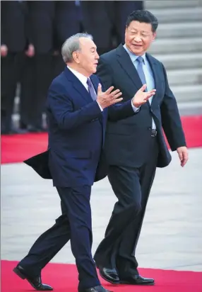  ?? FENG YONGBIN / CHINA DAILY ?? President Xi Jinping accompanie­s Kazakh President Nursultan Nazarbayev during a welcoming ceremony outside the Great Hall of the People on Thursday.