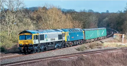  ??  ?? Released from Eastleigh Works in its new livery, No. 66793 heads No. 47749 and two barrier coaches past Hatton North Junction, Warwickshi­re, as the 5E02 Eastleigh Works to Doncaster Down Decoy on March 26. Tom Stobbs