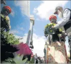  ?? Picture: FREDLIN ADRIAAN ?? PAYING TRIBUTE: Thandiwe Mdlanko, left, and Xolile Mini at the wreath-laying ceremony at the Papenkuil Cemetery