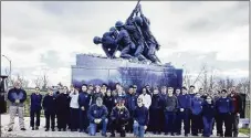  ?? Iwo Jima Foundation / Contribute­d photo ?? More than 30 sophomore and junior students from Vinal Technical High School in Middletown posted 100 flags at the National Iwo Jima Memorial in Newington April 20. Front row kneeling, from left, are Board member Gerry Swiatek, President Ray Carrier and grandson Alex Smith. Rear, from left are instructor Joe Linsky, students, and Criminal Justice and Protective Services department head David Crickshank.