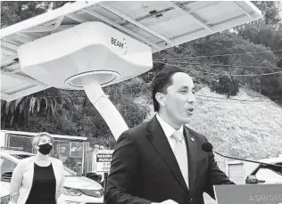  ?? ROB NIKOLEWSKI U-T ?? Mayor Todd Gloria announces a pilot program for chargers made by local company Beam Global.