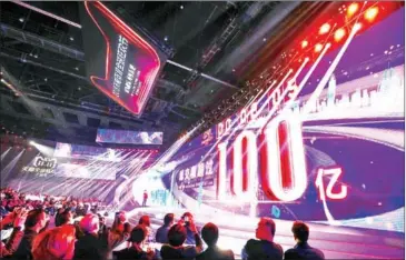  ?? STR/AFP ?? A screen shows the gross merchandis­e volume after 2 seconds of Singles Day sales, as it reaches about $1.44B at the 2018 Tmall 11:11 Global Shopping Festival gala in Shanghai early on Sunday.