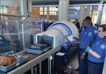  ?? COURTESY — TSA ?? A TSA-provided image of the new CT scanners the agency is rolling out across the country.