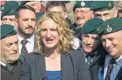  ??  ?? Claire Blackman, left, and retired servicemen celebrate the reduced sentence for her husband, far right