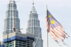  ??  ?? KEEP THE FLAG FLYING: A Malaysian flag flies in Kuala Lumpur. Malaysian elections that could determine Prime Minister Najib Razak’s political survival are set for May 9.