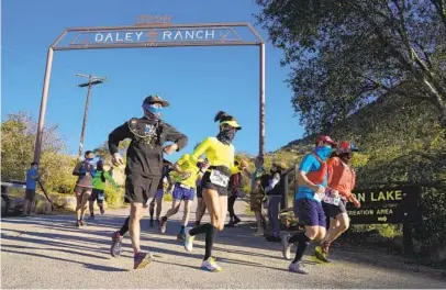  ?? NELVIN C. CEPEDA U-T PHOTOS ?? Competitor­s in Saturday’s The Ranch 50K/half Marathon were encouraged to wear masks, and start times were spaced out.