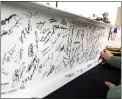  ?? DAN GLEITER — PENNLIVE ?? People sign a beam that will be placed in the new Wawa.
The groundbrea­king was held Wednesday for a Wawa on West Harrisburg Pike in Lower Swatara Township near Middletown.