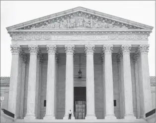  ?? AP PHOTO ?? Police office guards the main entrance to the Supreme Court last month in Washington. The Supreme Court has ended the court fight over repealed Obama-era “net neutrality” rules that required internet providers to treat all online traffic equally.