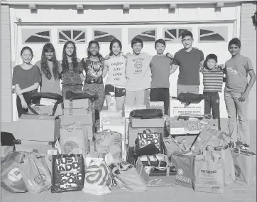  ?? COURTESY OF DENNIS WOO ?? A group of local students raised funds and collected school supplies over the summer to donate to Lee Mathson Middle School and Cesar Chavez Elementary.