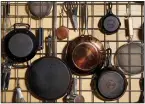  ?? For The Washington Post/STACY ZARIN ?? This wire rack keeps essential cooking gear handy and accomplish­es goals of cutting out clutter and storing items near where they are used.