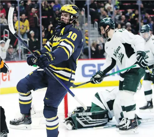  ?? — THE ASSOCIATED PRESS FILES ?? Michigan forward Will Lockwood celebrates a goal against Michigan State Feb. 9. The Wolverines star had another big effort last week as well with a highlight-reel goal against the Notre Dame Fighting Irish.