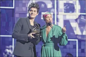  ?? Matt Sayles / Invision / AP ?? John Mayer, left, and Alicia Keys present the award for song of the year at the 61st annual Grammy Awards on Feb. 10 in Los Angeles. Mayer opened his tour with a two-set performanc­e at the Times Union Center on Friday.
