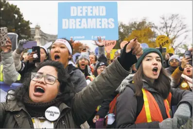  ?? Chip Somodevill­a / Getty Images ?? Hundreds of people gather outside the U.S. Supreme Court to rally in support of the Deferred Action on Childhood Arrivals program as the court hears arguments about DACA on Tuesday in Washington, D.C. The court heard arguments in the case that tests the legality of the DACA program, a federal immigratio­n policy that has given protection from deportatio­n to 700,000 people brought to the U.S. as children. The Trump Administra­tion announced the end of the program in 2017.