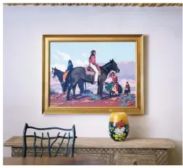  ??  ?? Billy Schenck’s oil August hangs above the sideboard in the dining room. The glass flower vase is by Shawn Messenger.