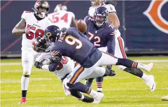  ?? CHARLES REX ARBOGAST/AP ?? Foles fumbled on this play in the fourth quarter, but the Bears recovered the ball.