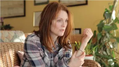  ?? LINDA KALLERUS/THE ASSOCIATED PRESS FILE PHOTO ?? Julianne Moore depicted a woman suffering from early onset Alzheimer’ disease in the 2014 film Still Alice.