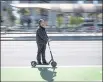  ?? DAVID PAUL MORRIS — BLOOMBERG NEWS ?? A person rides a Bird Rides shared electric scooter on the Embarcader­o in San Francisco.