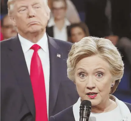  ?? AP FILE PHOTO ?? NOW NOTORIOUS: Hillary Clinton speaks while now-President Trump watches during their second presidenti­al debate in St. Louis last October.