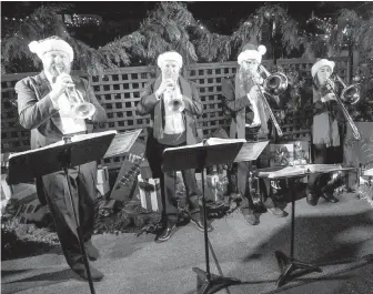  ??  ?? A brass quartet serenaded Butchart Gardens visitors at the light-up event.