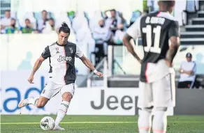  ?? AFP ?? Juventus’ Cristiano Ronaldo converts a free-kick against Torino.