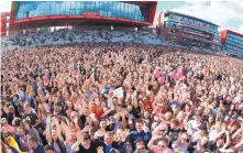  ?? DAVE HOGAN/ASSOCIATED PRESS ?? A view of the crowd at the One Love Manchester tribute concert in Manchester, England, on Sunday. Ariana Grande, Katy Perry and other music stars performed at the fundraisin­g event.