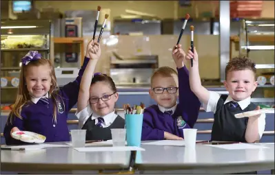  ??  ?? Elise Donnachie, Grace Cleary, Michal Calka and Robbie Anderson of St Monica’s Primary get to work on the project