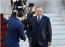  ?? AP ?? Greece’s prime minister Alexis Tsipras receives Turkey’s president Recep Tayyip Erdogan at his office in Athens yesterday