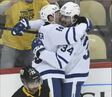  ?? Associated Press ?? Toronto’s Mitchell Marner, right, extended his points streak to 16 games with a goal in the first period.