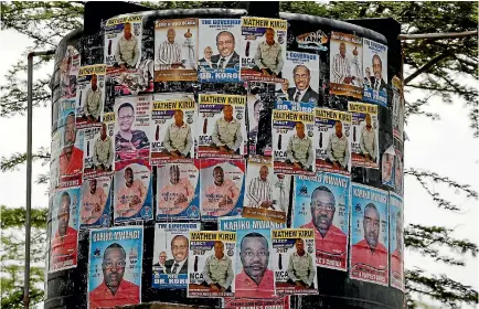  ?? PHOTO: REUTERS ?? Campaign posters of candidates for the role of local representa­tive are seen on a water tank in the Barut ward, Nakuru, Kenya.