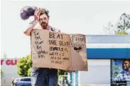  ?? Gabrielle Lurie / The Chronicle ?? Anthony Fallstead, who is homeless, seeks help in Santa Rosa during the heat wave early this month.