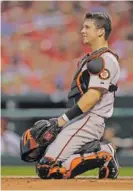  ?? AP PHOTO/JEFF ROBERSON ?? San Francisco Giants catcher Buster Posey takes up his position during a game against the St. Louis Cardinals in 2010 in St. Louis.