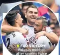  ??  ?? V FOR VICTORY: Vokes is mobbed after scoring twice