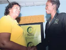  ?? FILE ?? Dr Paula Daley-Morris (right), president of Netball Jamaica, greets Jermaine Allison-McCracken, Sunshine Girls head coach, at the Social Developmen­t Foundation office on April 6.