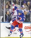  ??  ?? Brady Skjei #76 of the New York Rangers hits Artturi Lehkonen #62 of the Montreal Canadiens into the boards during the first period in Game Three of the Eastern Conference First Round during the 2017 NHL Stanley Cup Playoffs at Madison Square Garden on April 16, inNew York City. (AFP)