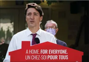  ?? The Canadian Press ?? Liberal Leader Justin Trudeau is joined by Liberal candidate for Surrey-South—White Rock, Gordie Hogg for a campaign stop in Surrey on Wednesday.